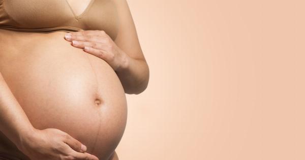 How does the woman’s body change in week 14 of pregnancy?