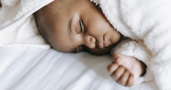 The kid is wetting his bedding while asleep