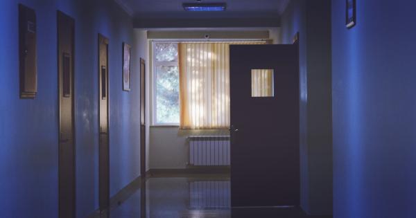 What factors contribute to low lighting in hospital rooms?